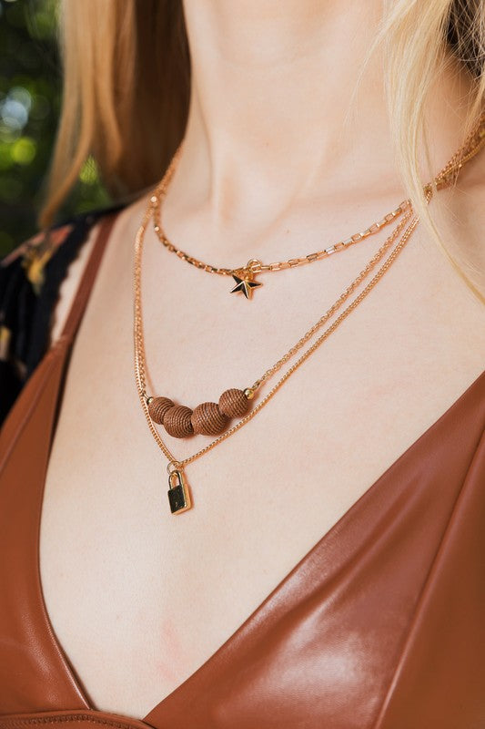 Three Layered Rustic Gold Charmed Necklace Necklaces