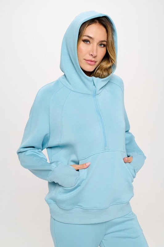 Women’s ultra comfy quarter-zip hoodie in soft light blue with kangaroo pockets
