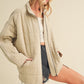 Beige quilted Dixie Jacket with high collar and front zipper