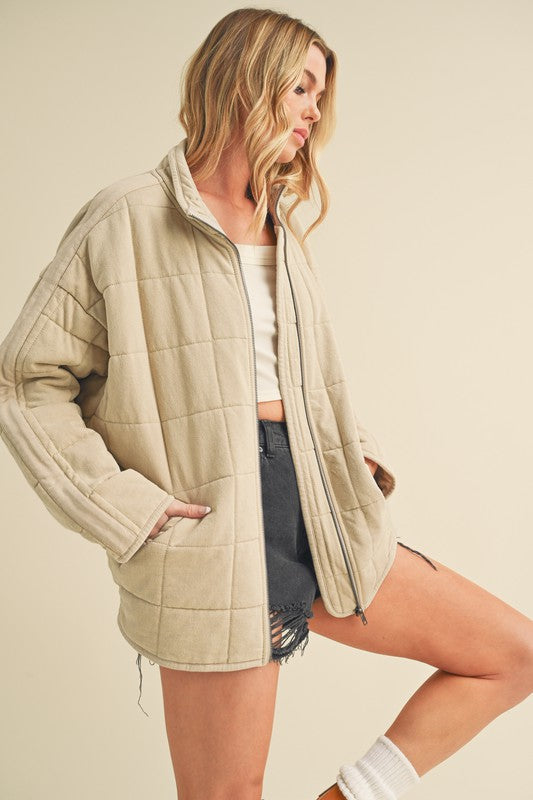 Beige quilted Dixie Jacket with high collar and front zipper