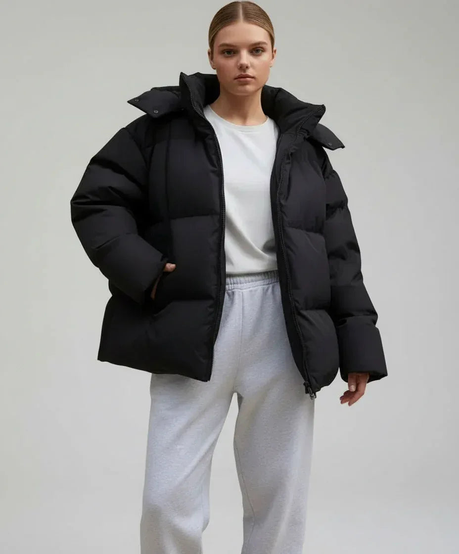 Black pocketed zip-up hooded puffer jacket with oversized design