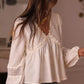 Delicate off-white Lace Trim V-Neck Blouse with intricate lace detailing