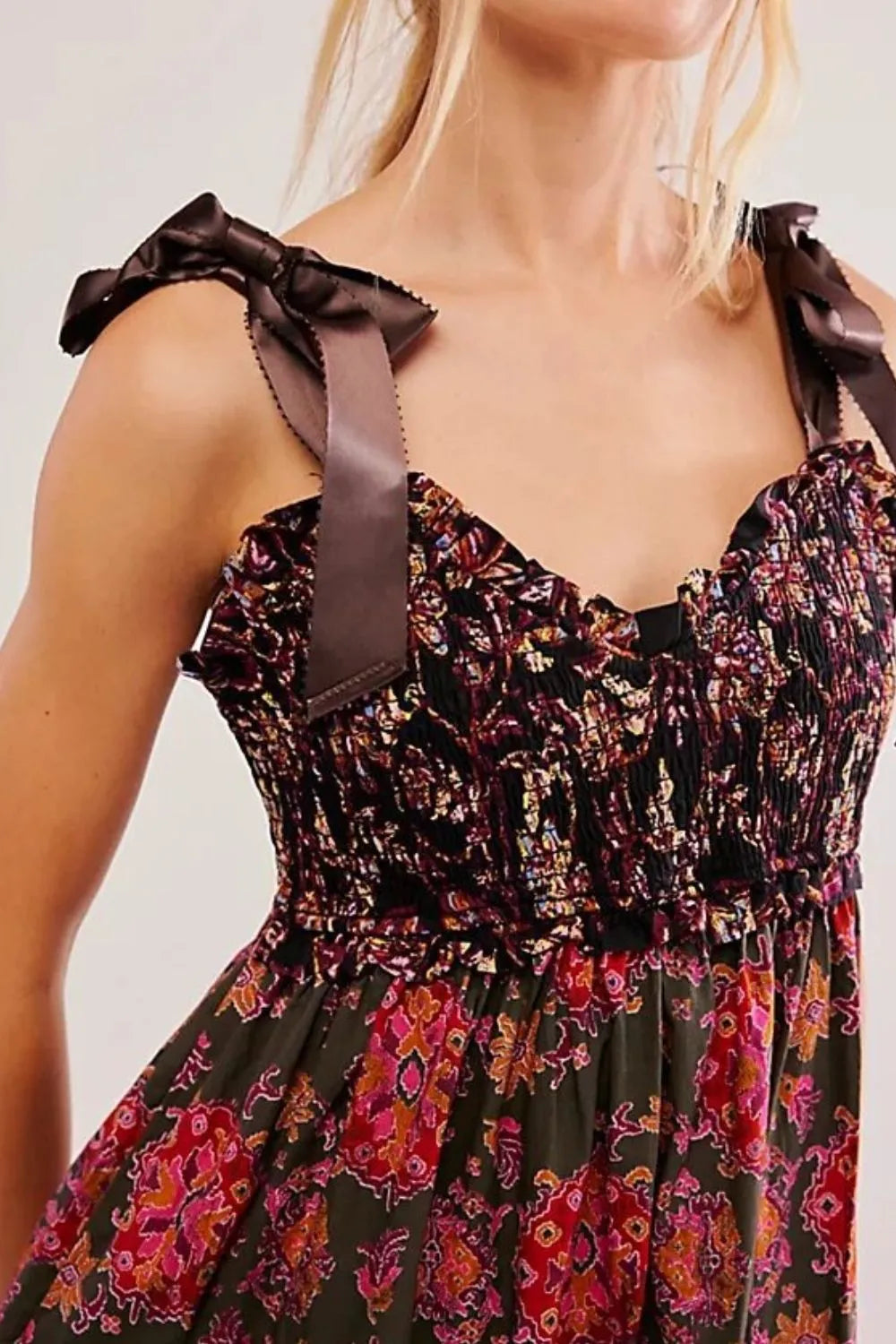 Floral tiered maxi dress in dark green print with ruffled shoulder bows