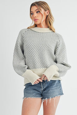 Cozy off-white Aemi + Co Echo loose fit knit sweater with geometric pattern