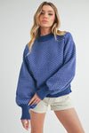 Blue Aemi + Co Echo oversized knit sweater with white geometric pattern