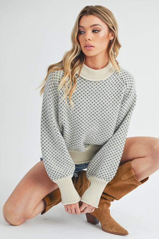 Cozy off-white Aemi + Co Echo loose fit knit sweater with geometric pattern