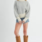 Woman in Aemi + Co Echo Loose Fit Knit Sweater, small