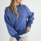 Blue Aemi + Co Echo loose fit knit sweater with white geometric pattern