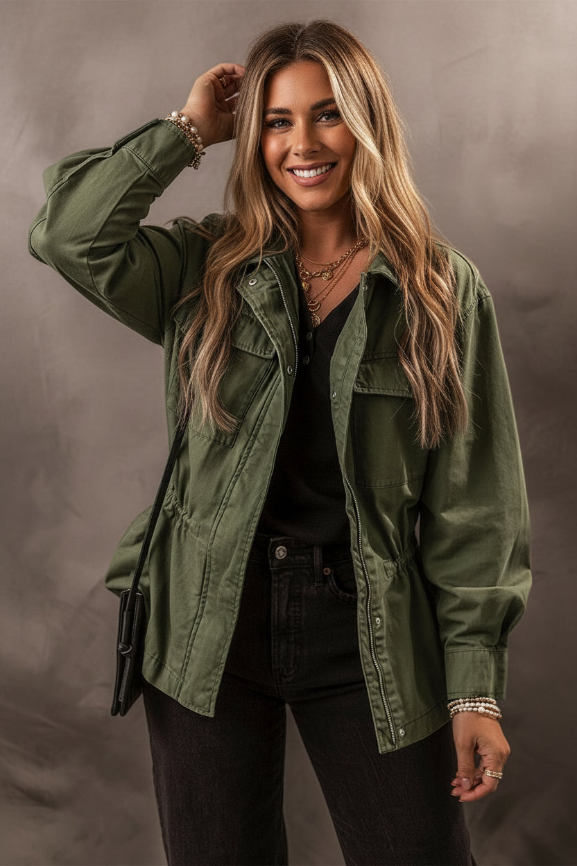 Olive green zip-up utility jacket with black accents and silver hardware