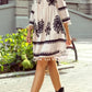 Tassel hem 3/4 sleeve mini dress with white embroidery, black floral patterns