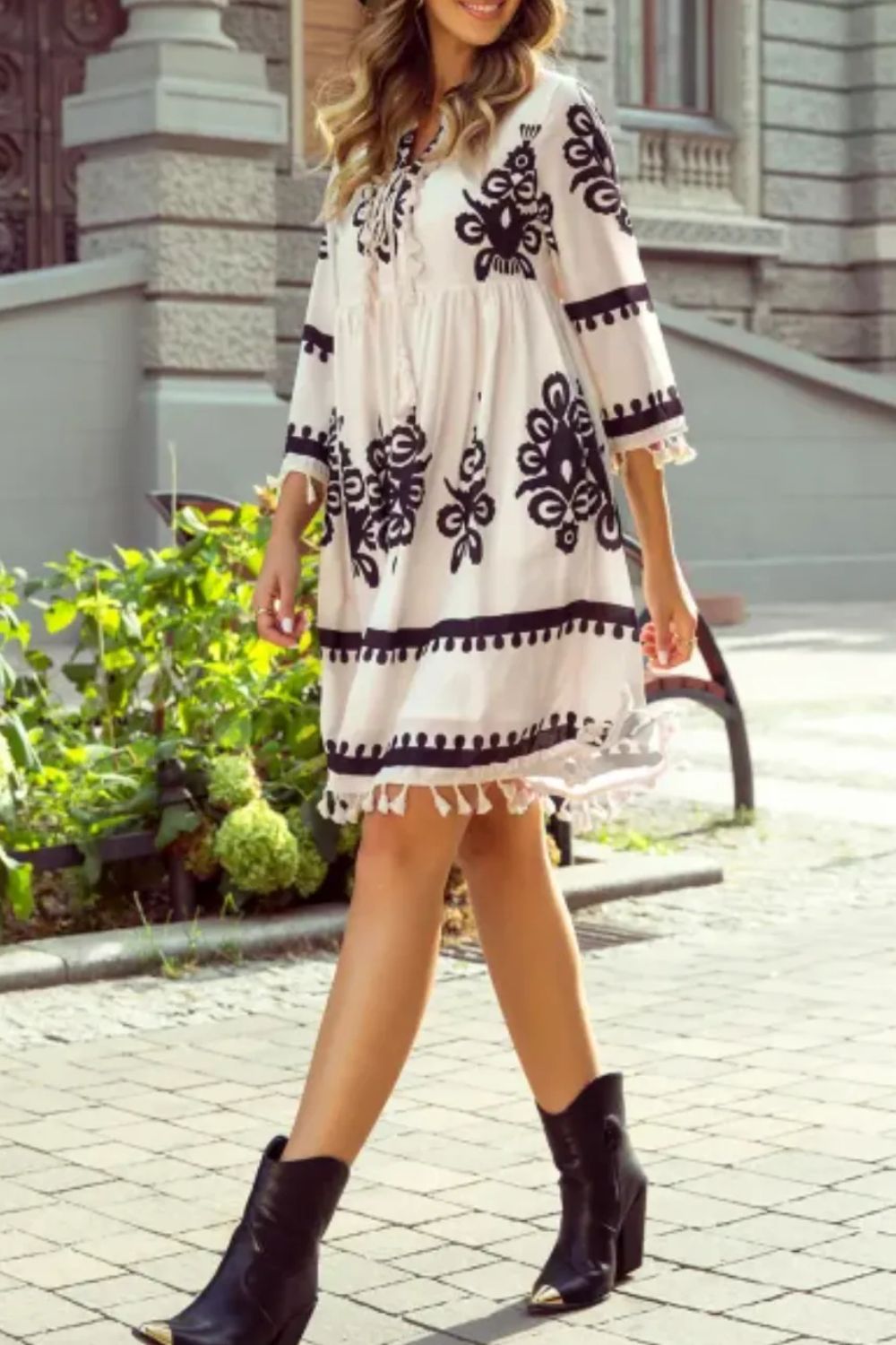 Tassel hem 3/4 sleeve mini dress with white embroidery, black floral patterns