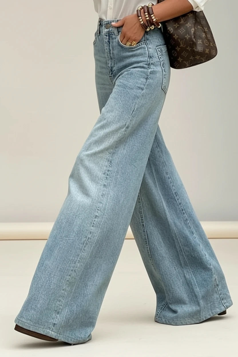 Light-wash denim wide-leg jeans with a classic five-pocket design and subtle fading for a relaxed, contemporary look.