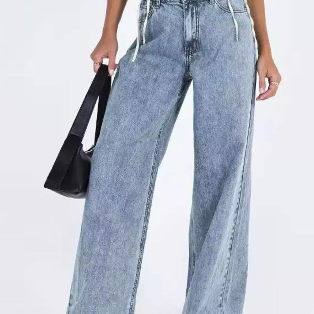 Light blue wide-leg denim jeans with frayed hems, high waist, pockets
