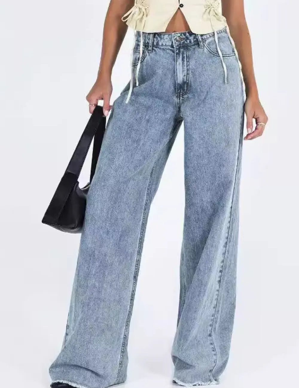Light blue wide-leg denim jeans with frayed hems, high waist, pockets