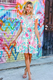 Under Your Spell Floral Smocked Flutter Sleeve Ruffle Mini Dress | Daverri Fashions