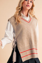 Beige Aemi + Co Side Tie V Neck Vest Poncho with red stripes and tassels