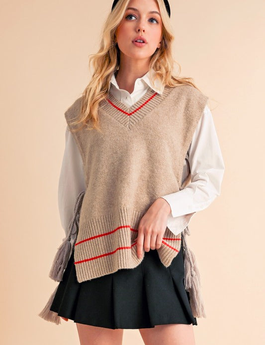 Beige and red striped knit vest poncho with tassels by Aemi + Co