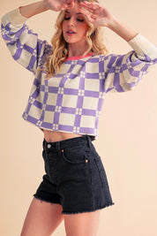 Lavender and white checkered Aemi + Co cropped boxy sweater with ruffled sleeves