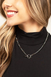 18K stainless steel silver toggle chain necklace with modern design on black turtleneck