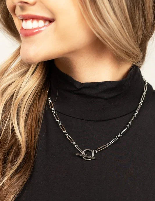 18K stainless steel silver toggle chain necklace with modern design on black turtleneck