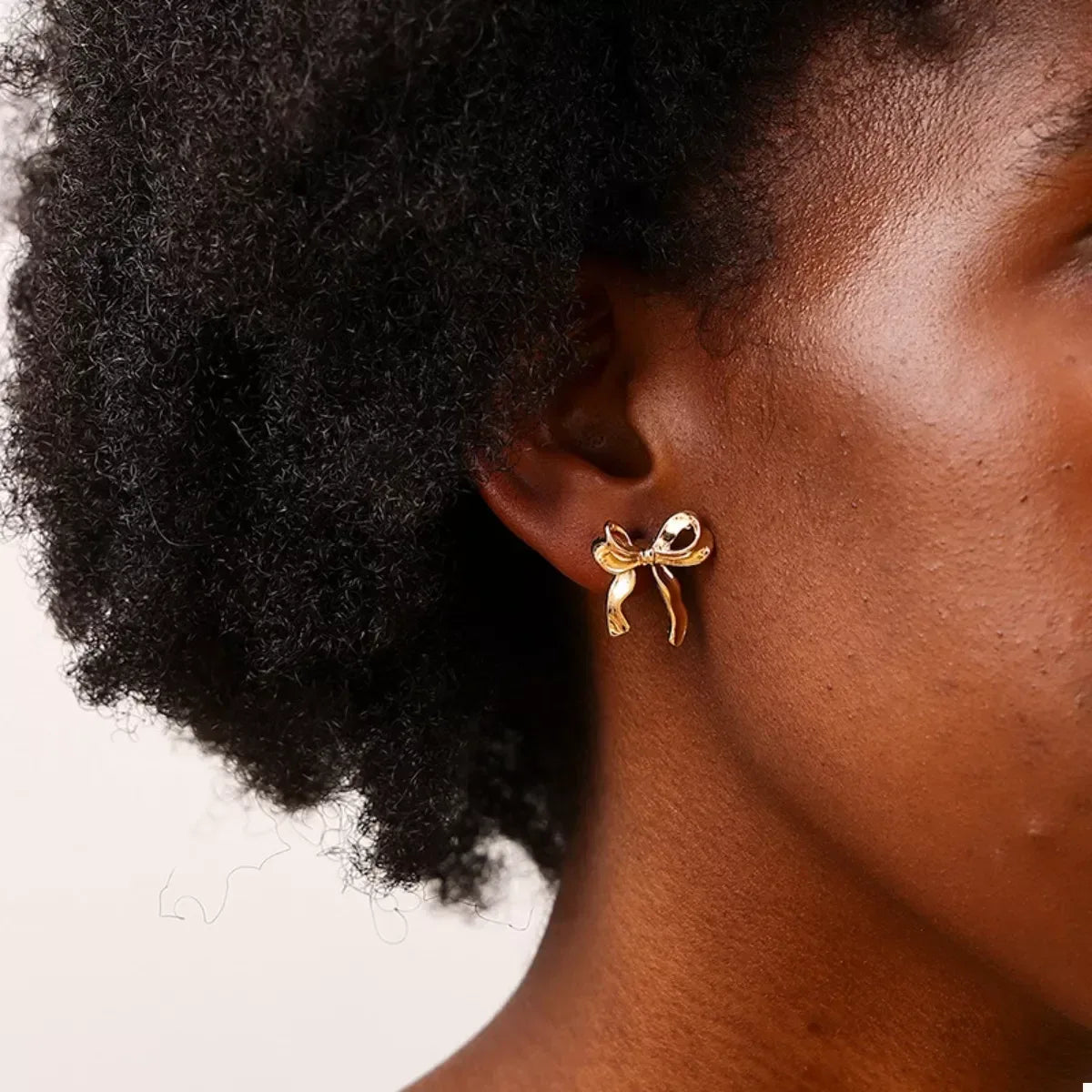 18K Gold-Plated Alloy Bow Stud Earrings - DAVERRI FASHIONS