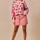 Pink rose and heart knit sweater on SO ME vintage wash denim mini skirt