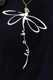 White dragonfly pendant necklace on graphic round neck t-shirt