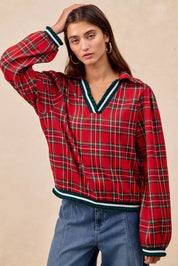 Red plaid bomber jacket with green white trim and ruffles