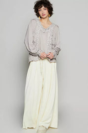 Cream wide-leg pants with lace hem and POL Floral Embroidery Top