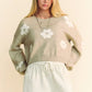 Beige knit cropped sweater with white floral embroidery by Davi & Dani