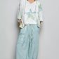 POL Floral Star Patch Hooded Blouse with white star pattern, floral embroidery, and flowing lace sleeves