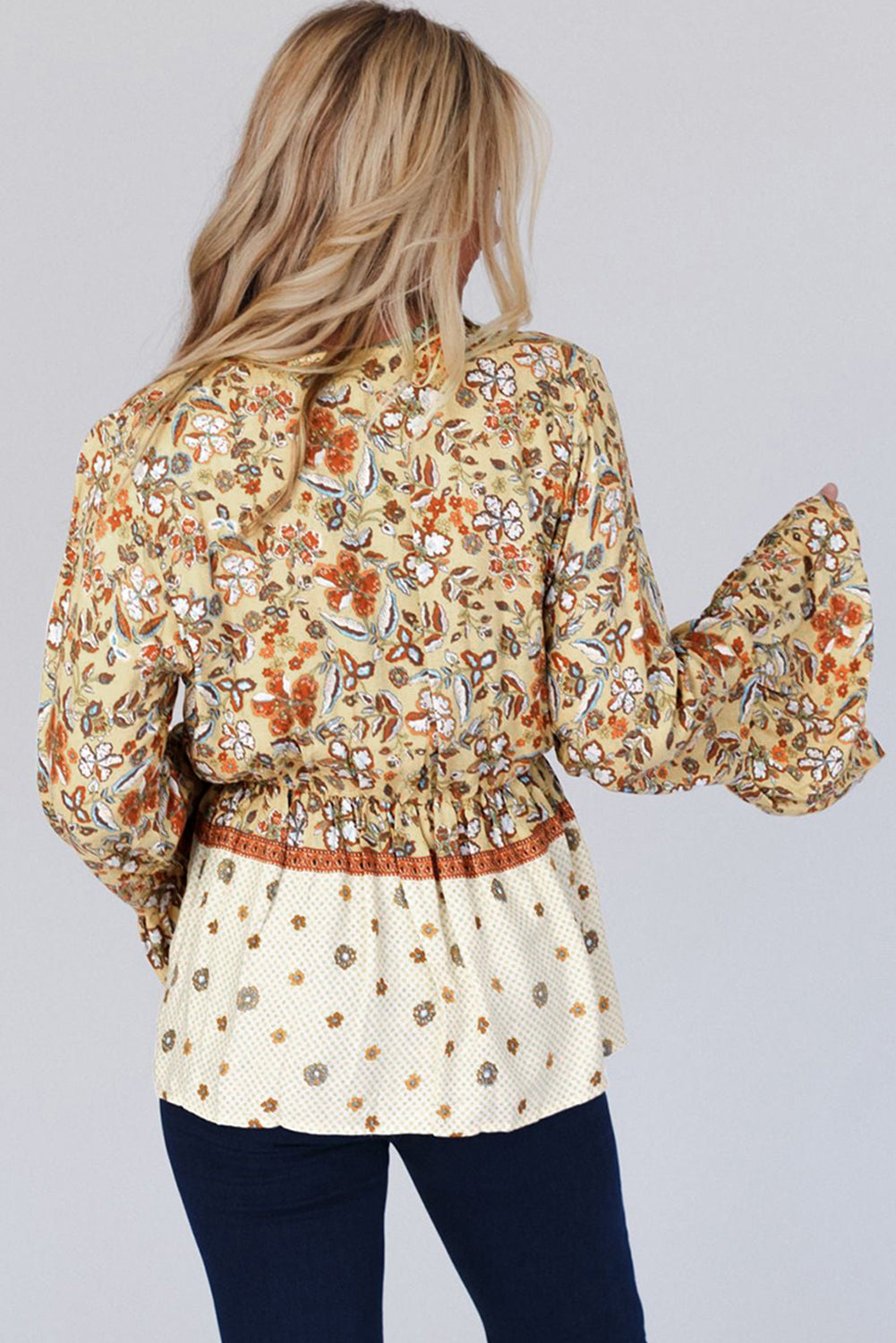 Yellow printed floral bell sleeve V-neck peplum blouse in beige