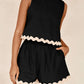 Daverri Fashions black sleeveless top and shorts set with cream ruffle trim