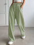 Daverri Striped High-Waisted Wide Leg Pants in green and white vertical stripes