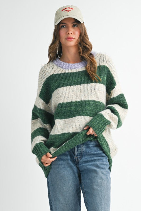 Oversized green and white striped sweater with ribbed cuffs