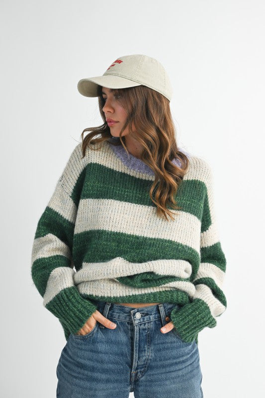 Oversized green and white striped knit sweater with ribbed neckline