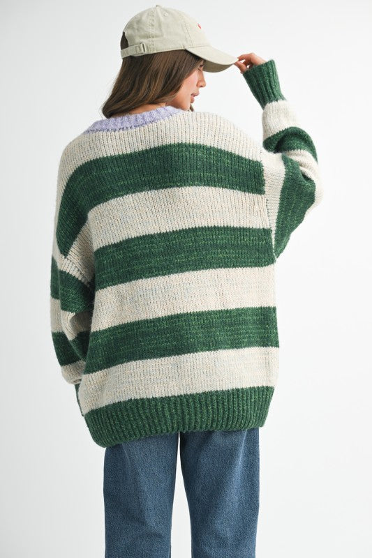 Green and white striped oversized knit sweater by Urban Outfitters