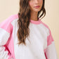 Colorblock terry pullover sweatshirt in soft white with pink sleeves