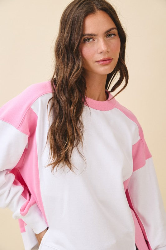 Colorblock terry pullover sweatshirt in soft white with pink sleeves