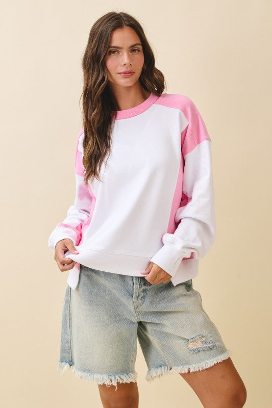 Pink and white color-blocked long-sleeve terry pullover sweatshirt with ribbed cuffs