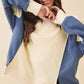 Cream and blue colorblock terry pullover bomber sweatshirt with ribbed cuffs