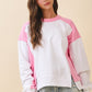 Soft white and pink two-tone raglan terry pullover sweatshirt