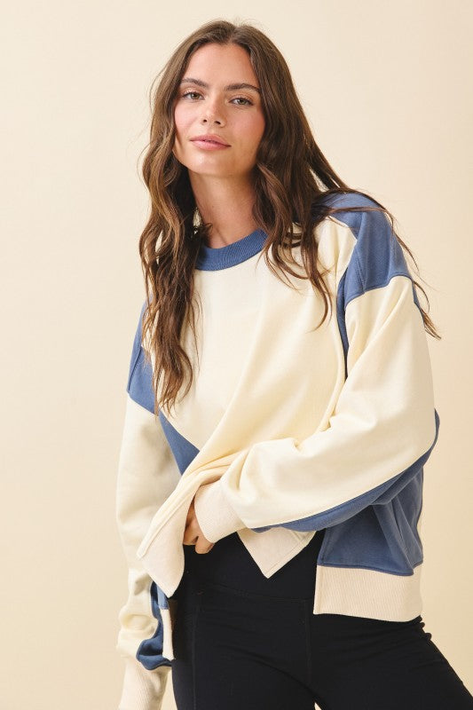 Colorblock terry pullover sweatshirt in cream and navy blue with ribbed cuffs