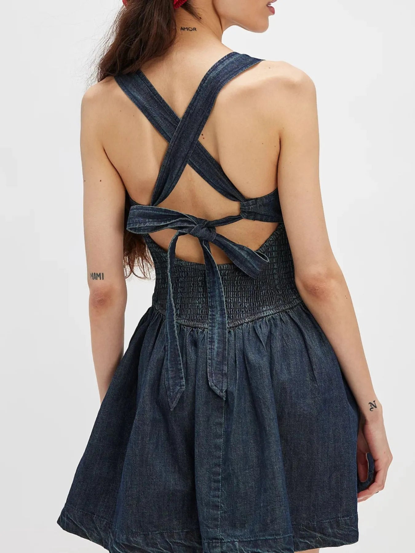 Daverri smocked crisscross back denim mini dress with waist bow