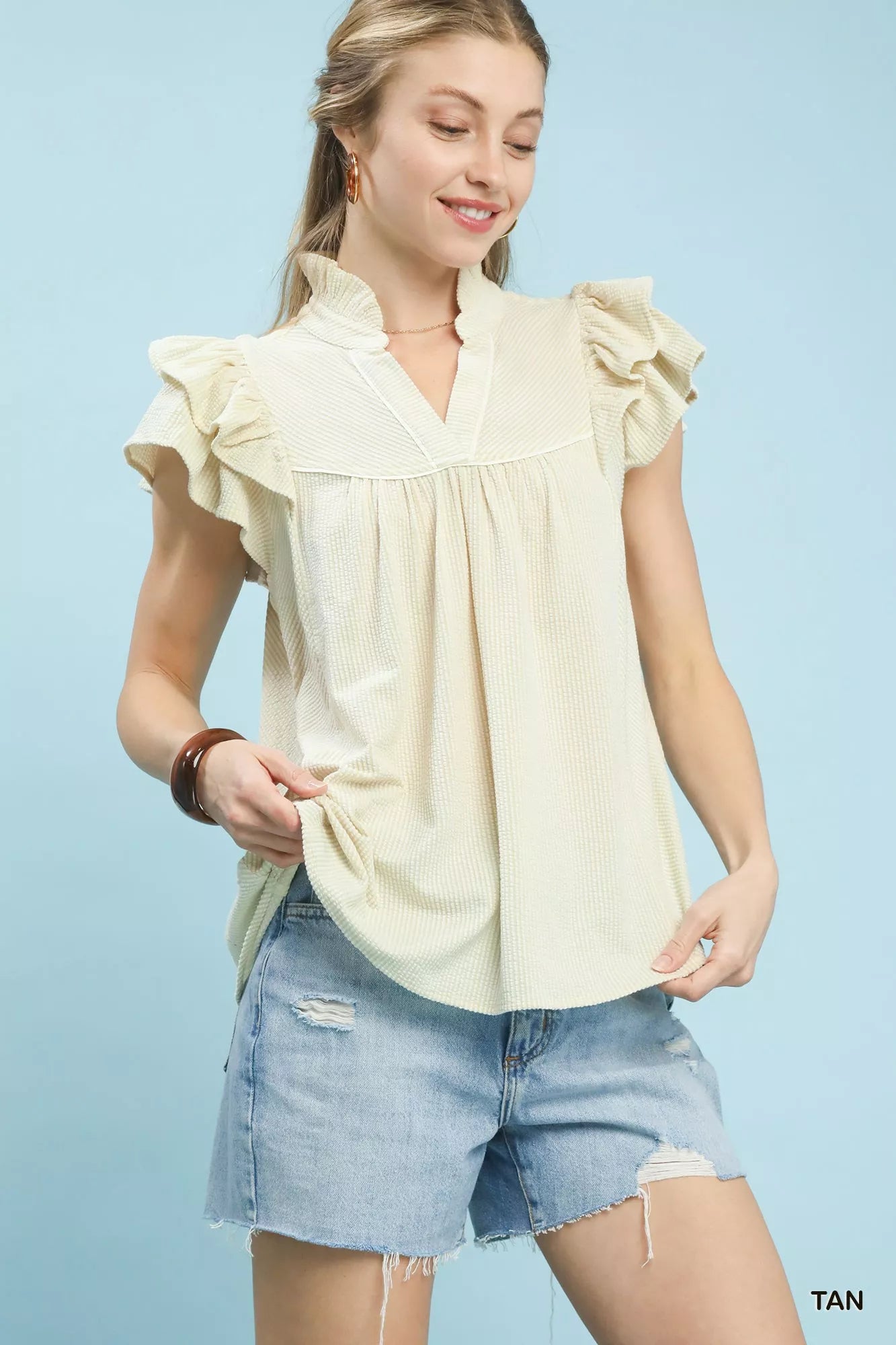 Umgee Ruffled Sleeve Textured Blouse in cream-colored ribbed fabric
