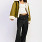 Olive green shearling-lined reversible suede bomber jacket with cream fur trim