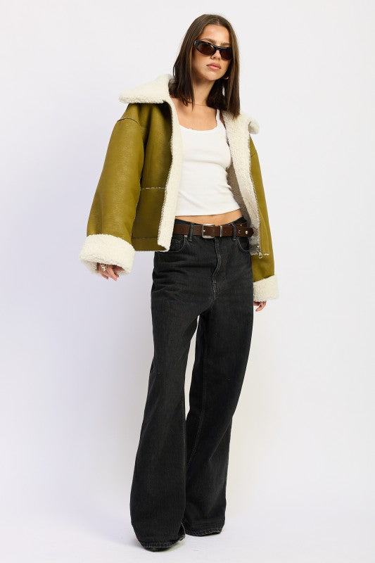 Olive green shearling-lined reversible suede bomber jacket with cream fur trim