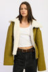 Reversible suede shearling jacket in olive green with plush white interior