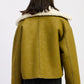 Reversible suede shearling jacket in olive green with plush white fur collar