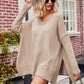 Beige v-neck oversized knit sweater with ribbed cuffs and hem